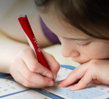 girl doing homework with nabi pen